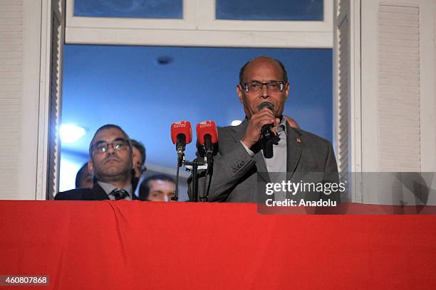 Tunisia's outgoing president Moncef Marzouki delivers a speech at his campaign headquarters a day after his rival Beji Caid Essebsi's victory in the...