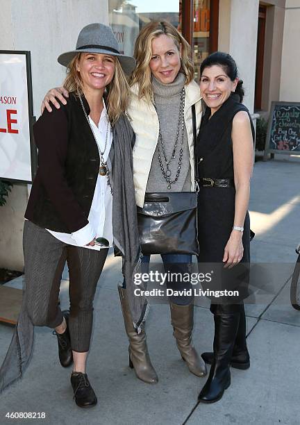 Actress Maria Bello and Clare Munn pose with Dorothy Livingston while holiday shopping on Montana Ave on December 23, 2014 in Santa Monica,...