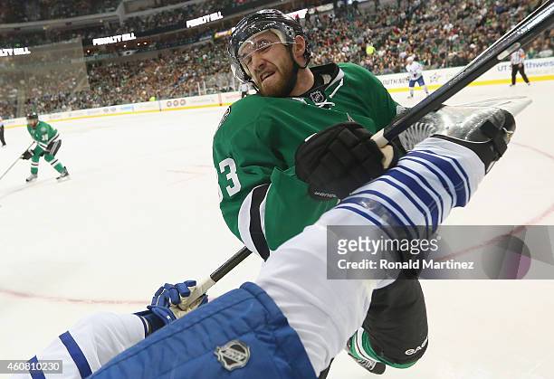 Alex Goligoski of the Dallas Stars checks Dion Phaneuf of the Toronto Maple Leafs during the second period at American Airlines Center on December...