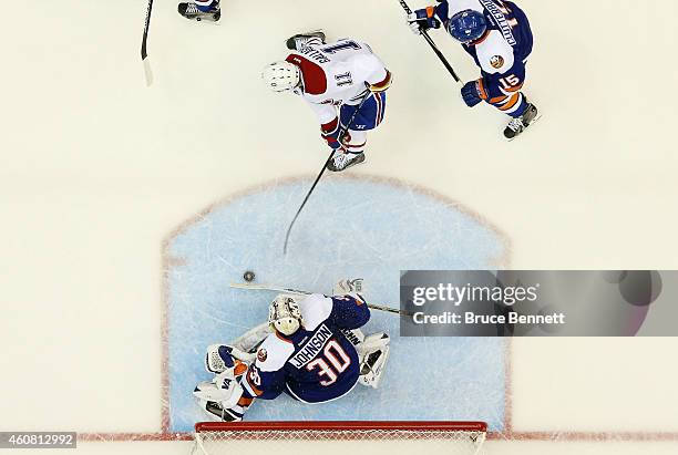 Brendan Gallagher of the Montreal Canadiens scores a second period goal past Chad Johnson of the New York Islanders at Nassau Veterans Memorial...