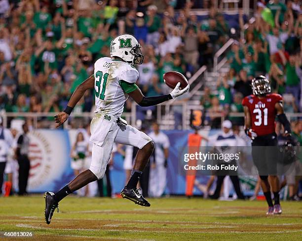 Evan McKelvey of the Marshall Thundering Herd scores a touchdown during the second half of the game against the Northern Illinois Huskies at FAU...
