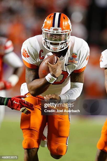 Tajh Boyd of the Clemson Tigers runs with the ball against the Ohio State Buckeyes during the 2014 Discover Orange Bowl at Sun Life Stadium on...