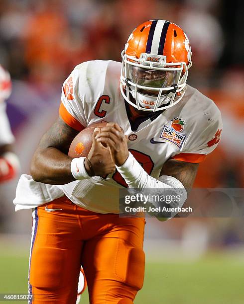 Tajh Boyd of the Clemson Tigers runs with the ball against the Ohio State Buckeyes during the 2014 Discover Orange Bowl at Sun Life Stadium on...