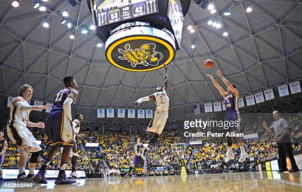 Guard Matt Bohannon of the Northern Iowa Panthers puts up a three-point shot over forward Nick Wiggins of the Wichita State Shockers during the...