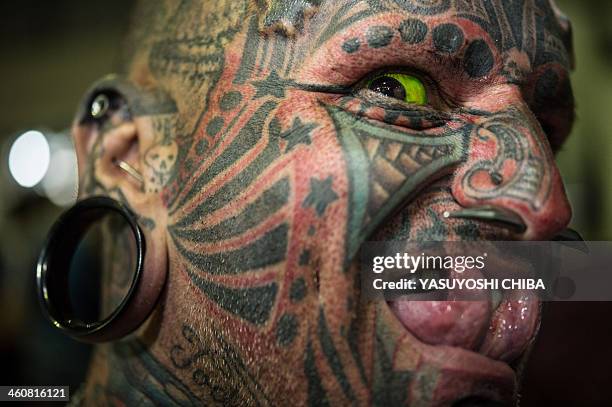 Uruguayan tatoo artist Victor Hugo Peralta poses for a picture during the Tatoo Week Rio in Rio de Janeiro, Brazil, on January 5, 2014. Peralta and...