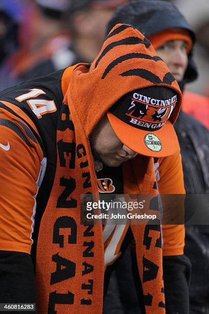 Dejected Bengals fan looks down during AFC Wild Card playoff game against the San Diego Chargers at Paul Brown Stadium on January 5, 2014 in...