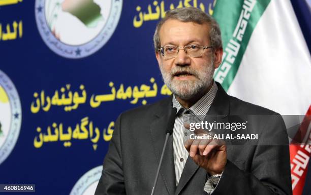 Iranian Parliament's speaker Ali Larijani speaks during a joint press conference with his Iraqi counterpart Salim al-Juburi following a meeting on...