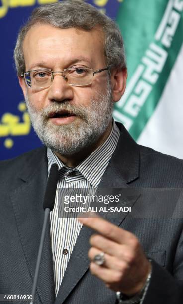 Iranian Parliament's speaker Ali Larijani speaks during a joint press conference with his Iraqi counterpart Salim al-Juburi following a meeting on...