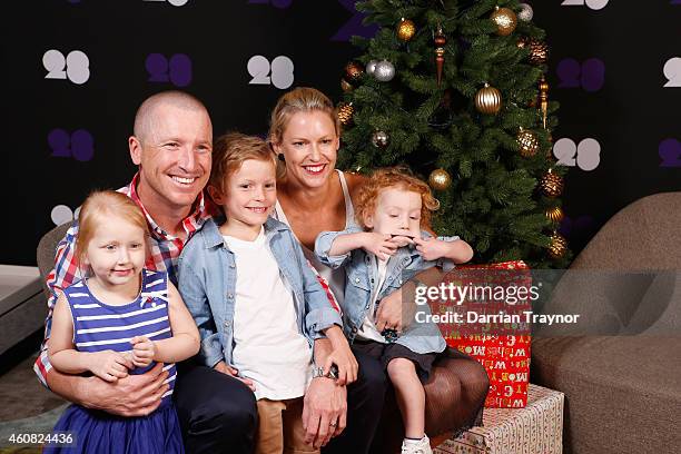 Brad and Karina Haddin pose for a photo with their children Mia, Zac and Hugo during an Australian Test squad Christmas Lunch at Melbourne Cricket...