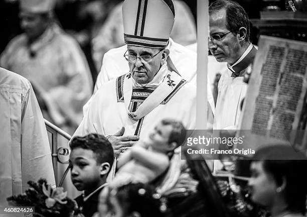 Pope Francis holds the Christmas night mass at St. Peter's Basilica on December 24, 2014 in Vatican City, Vatican.