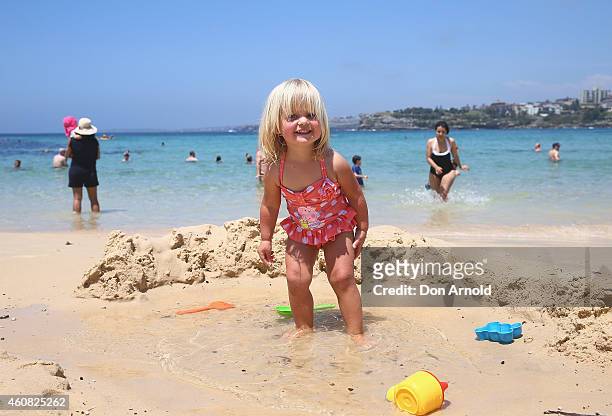 Grace McCartney from Bondi plays in the sand at Bondi Beach on December 25, 2014 in Sydney, Australia. Bondi Beach is a popular tourist destination...