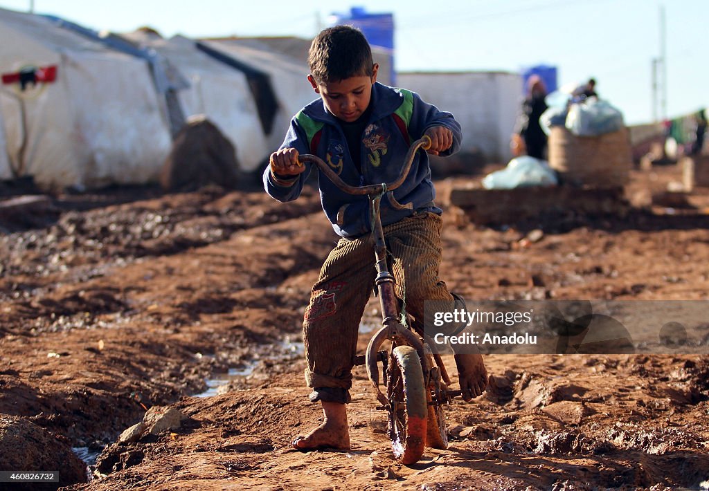 Refugees live under harsh living conditions in a Syrian refugee camp