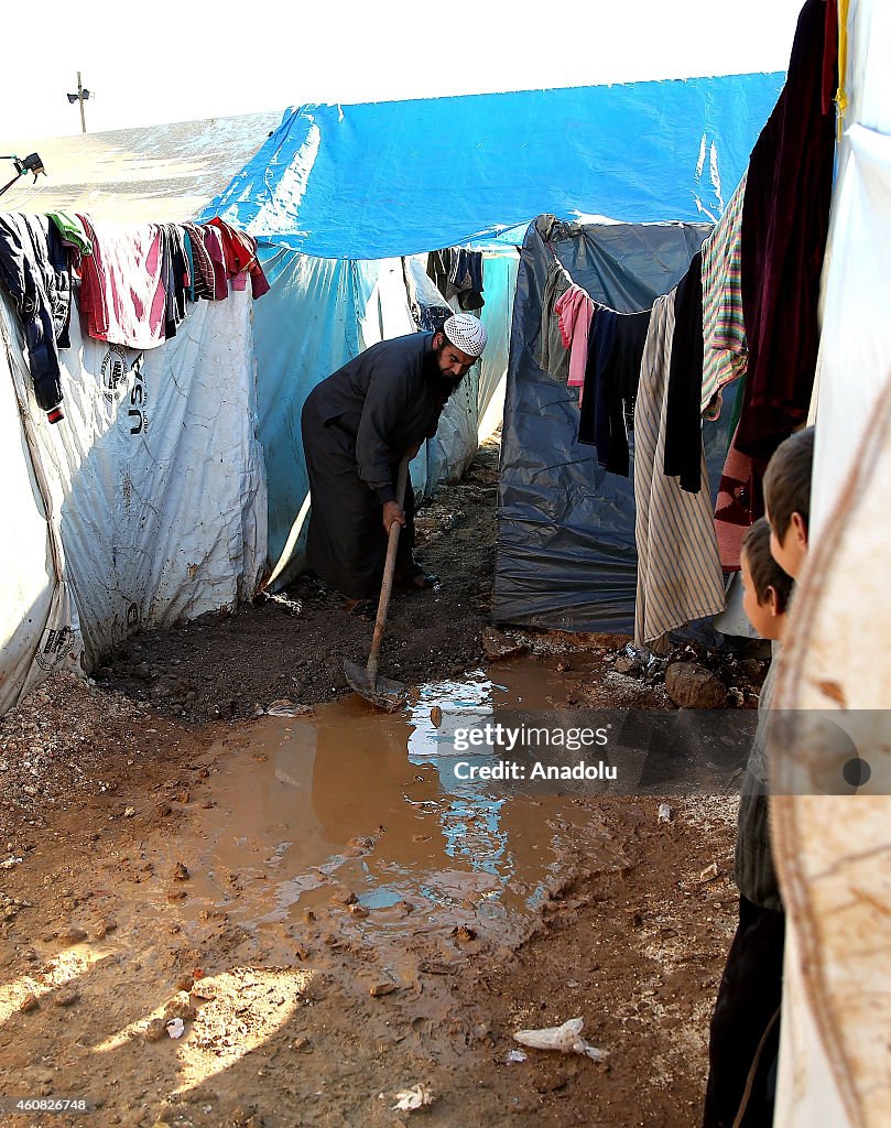 Refugees live under harsh living conditions in a Syrian refugee camp