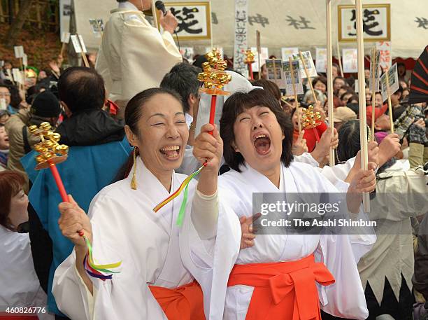 Shrine maidens laugh during the 'Owarai Shinji ' at Hiraoka Shrine on December 25, 2014 in Higashiosaka, Osaka, Japan. The annual ritual derives from...