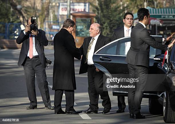 Turkey's Prime Minister Ahmet Davutoglu welcomes Iraqi Prime Minister Haider al-Abadi at the prime ministry building as he arrives in Ankara, Turkey...