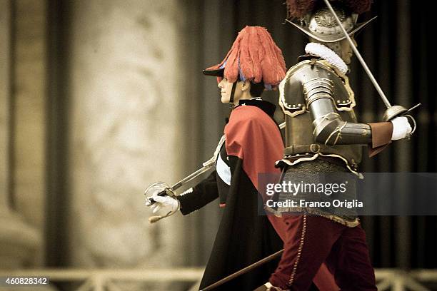 Swiss Guard and a Carabiniere, Italian special police, arrive in St. Peter's Square to attend Pope Francis' Christmas Day message from the central...