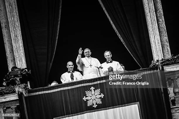 Pope Francis delivers his Christmas Day message from the central balcony of St Peter's Basilica on December 25, 2014 in Vatican City, Vatican.