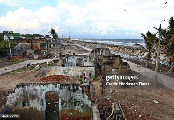 View of the fishermen's village of Akkaraipettai showing Tsunami damaged houses in the backdrop of a sea coast with a sea barrier on December 25,...