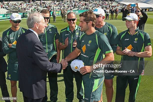 Joe Burns of Australia is presented his cap by Bill Lawry during day one of the Third Test match between Australia and India at Melbourne Cricket...