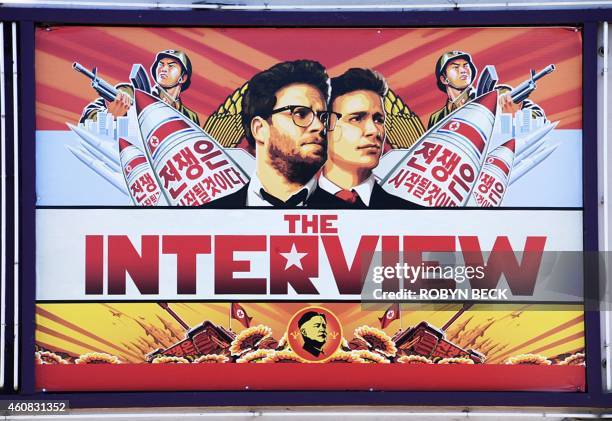 Poster for "The Interview" is displayed on the marquee of the Los Feliz 3 cinema December 25, 2014 in Los Angeles, California. Some two hundred US...