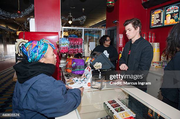 Movie goer purchases a ticket for Sony Pictures' release of "The Interview" at the Plaza Theatre on, Christmas Day, December 25, 2014 in Atlanta,...