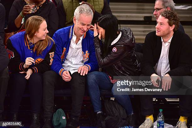 Anna McEnroe, John McEnroe, Sarah Silverman and guest attend New York Knicks vs Washington Wizards game at Madison Square Garden on December 25, 2014...