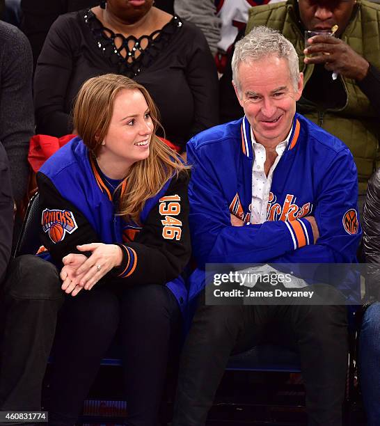 John McEnroe and daughter Anna McEnroe attend New York Knicks vs Washington Wizards game at Madison Square Garden on December 25, 2014 in New York...