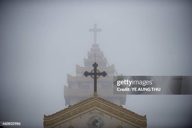 To go with Myanmar-religion-Catholics-unrest,FEATURE by Kelly MACNAMARA This photo taken on October 12, 2014 shows the exterior of a church in...