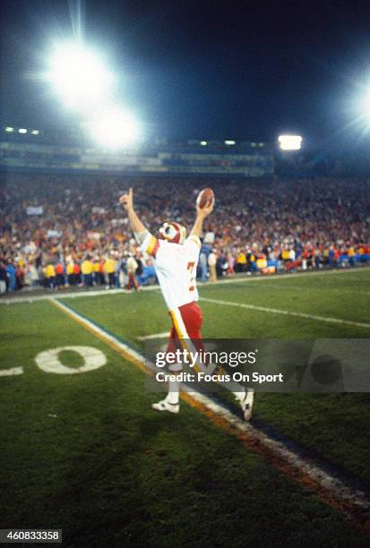 Quarterback Joe Theismann of the Washington Redskins celebrates defeating the Miami Dolphins in Super Bowl XVII on January 30, 1983 at the Rose Bowl...