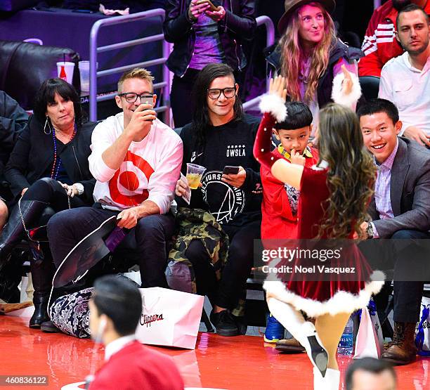 Diplo and Skrillex attend a basketball game on Christmas between the Golden State Warriors and the Los Angeles Clippers at Staples Center on December...