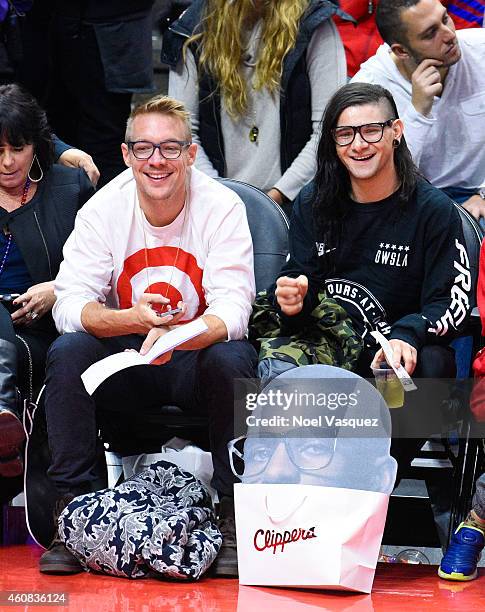 Diplo and Skrillex attend a basketball game on Christmas between the Golden State Warriors and the Los Angeles Clippers at Staples Center on December...