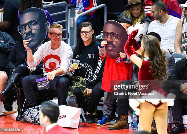 Diplo and Skrillex attend a basketball game on Christmas between the Golden State Warriors and the Los Angeles Clippers at Staples Center on December...