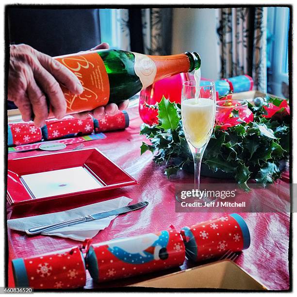 Bucks fizz is poured into a glass on Christmas morning on December 25, 2014 in Glasgow, Scotland. Millions of people across the UK spend time with...