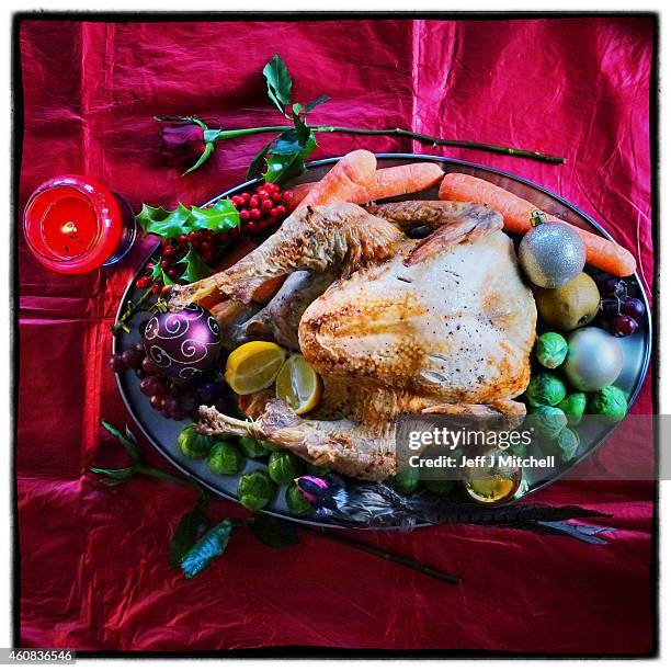 Turkey is placed on the Christmas dinner table on December 25, 2014 in Glasgow, Scotland. Millions of people across the UK spend time with family and...