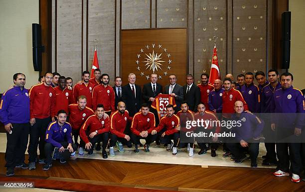 Turkish President Recep Tayyip Erdogan poses with Galatasaray's vice president Abdurrahim Albayrak , Member of the board of Galatasaray Sportif Inc....