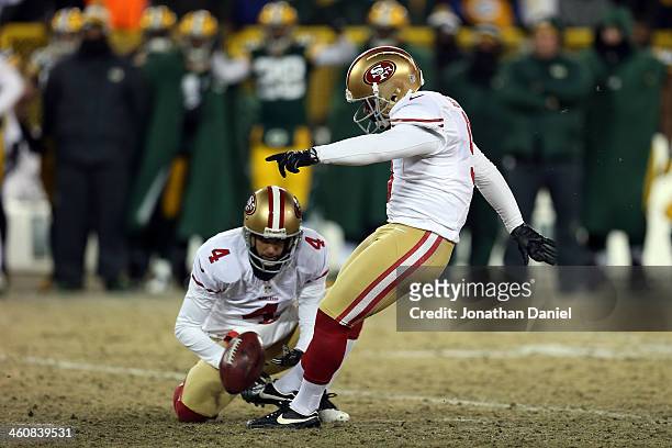 Phil Dawson of the San Francisco 49ers kicks a 33 yard field goal to defeat the Green Bay Packers in their NFC Wild Card Playoff game at Lambeau...