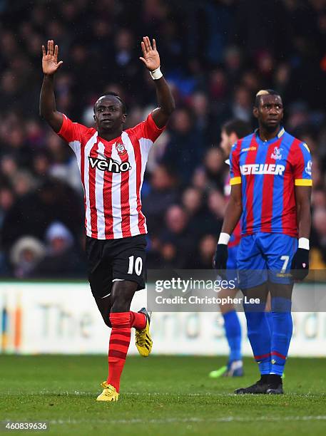 Despair for Yannick Bolasie of Crystal Palace as Sadio Mane of Southampton celebrates scoring their first goal during the Barclays Premier League...