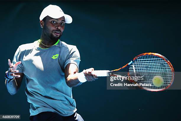 Donald Young of the USA plays a forehand during his qualifying match against Artem Sitak of New Zealand during day one of the Heineken Open at ASB...