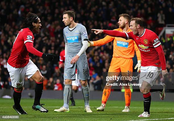 Wayne Rooney of Manchester United celebrates scoring the first goal with team-mate Radamel Falcao during the Barclays Premier League match between...