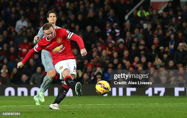 Wayne Rooney of Manchester United scores the second goal during the Barclays Premier League match between Manchester United and Newcastle United at...