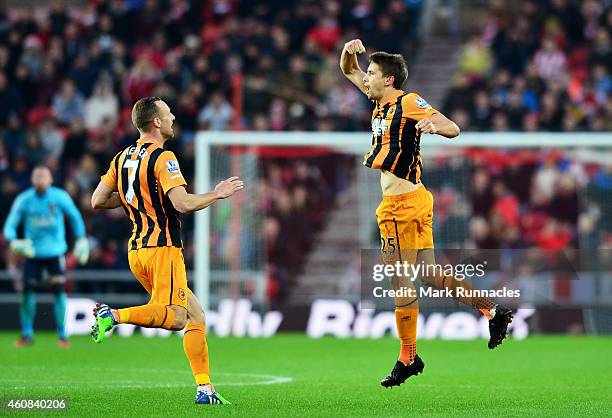 Gaston Ramirez of Hull City celebrates with teammate David Meyler of Hull City after scoring a goal to level the scores at 1-1 during the Barclays...