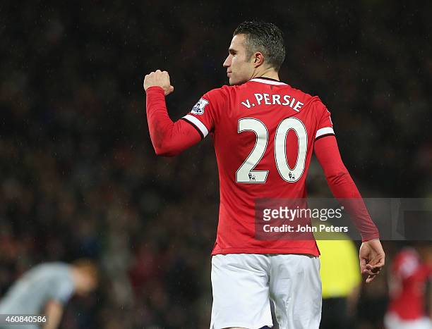 Robin van Persie of Manchester United celebrates scoring their third goal during the Barclays Premier League match between Manchester United and...