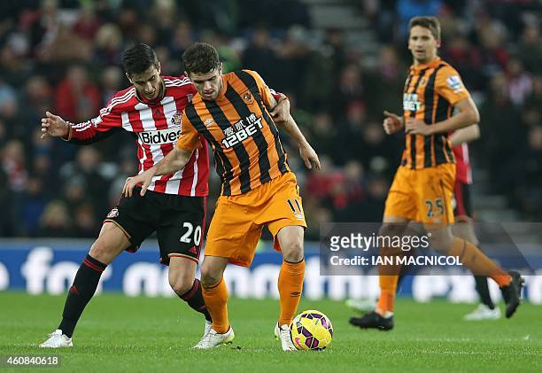 Hull City's Irish midfielder Robbie Brady vies with Sunderland's Argentinian midfielder Ricardo Alvarez during the English Premier League football...
