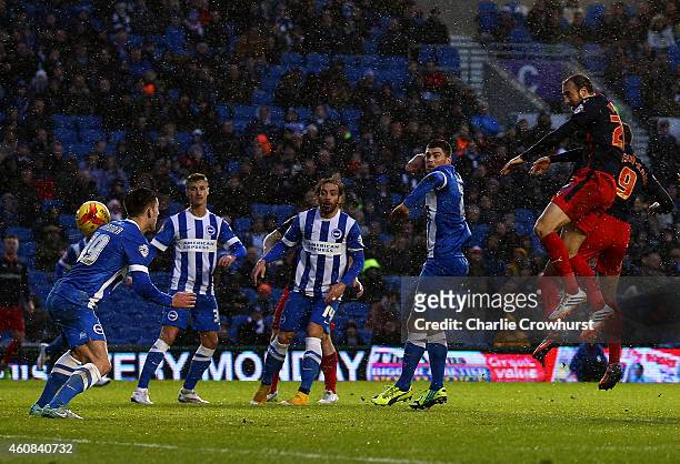 Glenn Murray of Reading scores his and the teams second goal of the game during the Sky Bet Championship match between Brighton and Hove Albion and...