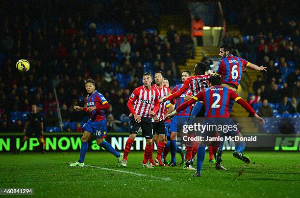 Scott Dann of Crystal Palace scores their first goal with a header during the Barclays Premier League match between Crystal Palace and Southampton at...