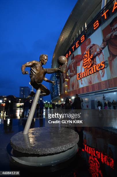 Picture shows the statue of Arsenal's Dutch former player Dennis Bergkamp outside the stadium ahead of the English Premier League football match...
