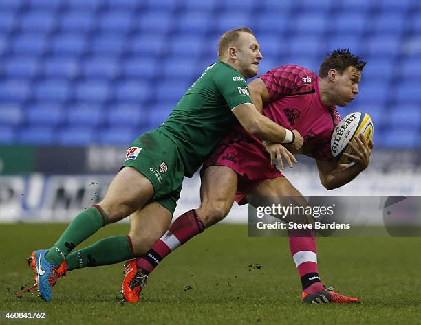 Shane Geraghty of London Irish tackles Will Robinson of London Welsh during the Aviva Premiership match between London Irish and London Welsh at...