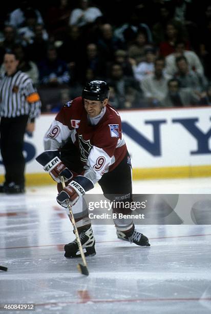 Wayne Gretzky of North America and the New York Rangers passes the puck during the 1998 48th NHL All-Star Game against the World on January 18, 1998...