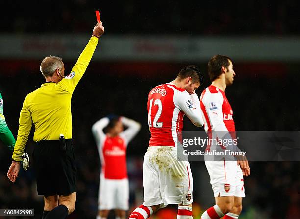 Olivier Giroud of Arsenal is sent off for a head butt on Nedum Onuoha of QPR by referee Martin Atkinson during the Barclays Premier League match...