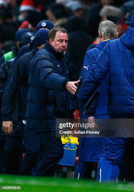 Harry Redknapp, manager of QPR shakes hands with Arsene Wenger, manager of Arsenal after the Barclays Premier League match between Arsenal and Queens...